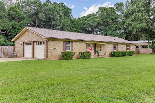6028 Laurelwood Dr, Milton, FL 32570 - ranch-style home with a garage, concrete driveway, and brick siding