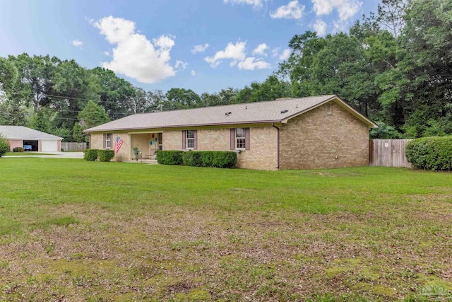 6028 Laurelwood Dr, Milton, FL 32570 - back of house featuring brick siding and a garage