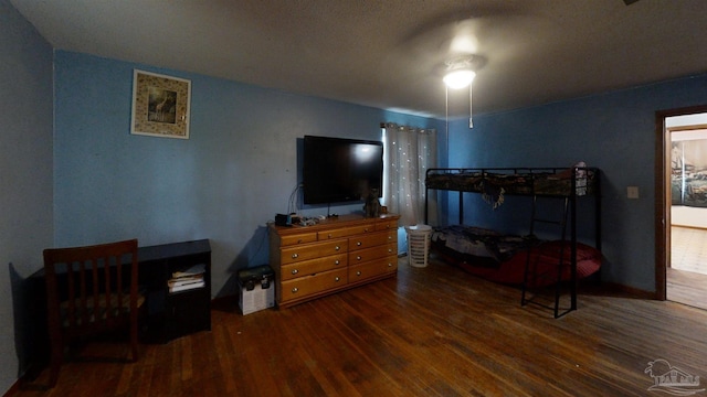 bedroom with wood finished floors