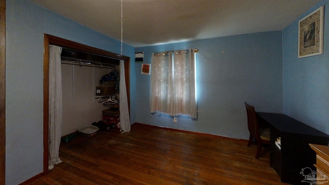 unfurnished bedroom featuring wood finished floors