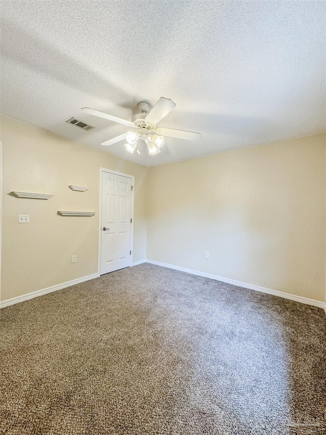 unfurnished room featuring carpet flooring, ceiling fan, and a textured ceiling