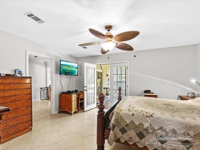 tiled bedroom with access to outside, french doors, and ceiling fan