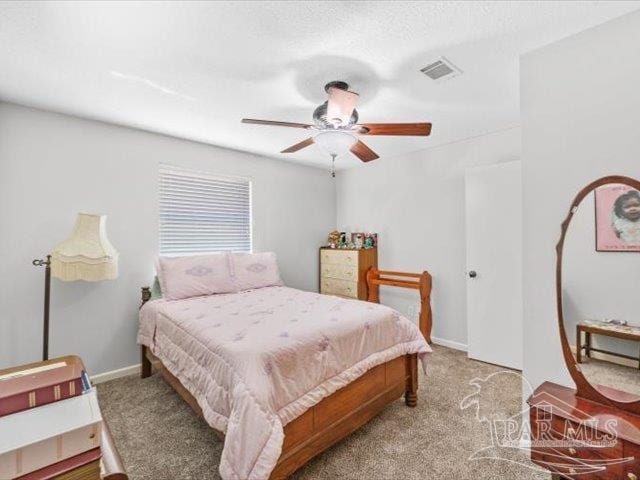 carpeted bedroom with ceiling fan