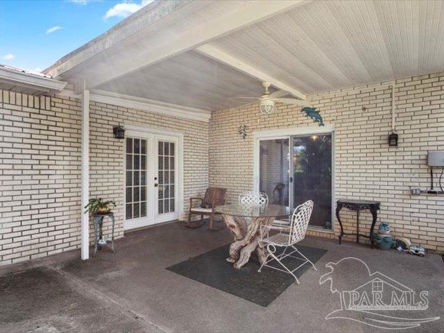 view of patio / terrace featuring french doors and ceiling fan