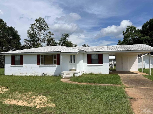 single story home featuring a front yard and a carport