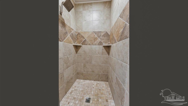 full bathroom with a tile shower