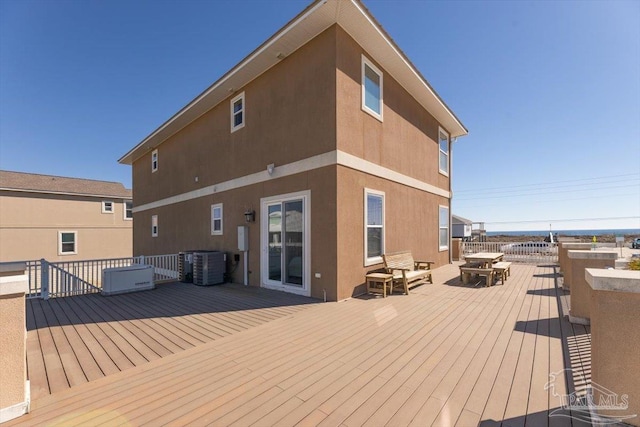 wooden deck with central air condition unit