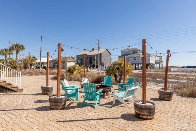 view of patio with a fire pit