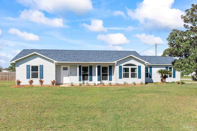 1548 Joseph Cir, Gulf Breeze, FL 32563 - ranch-style house featuring roof with shingles, a front lawn, and fence