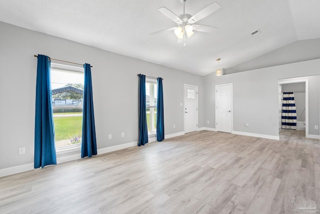 1548 Joseph Cir, Gulf Breeze, FL 32563 - spare room with visible vents, light wood-style flooring, a ceiling fan, a textured ceiling, and lofted ceiling