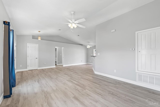 1548 Joseph Cir, Gulf Breeze, FL 32563 - unfurnished living room featuring baseboards, visible vents, ceiling fan, vaulted ceiling, and light wood-style floors