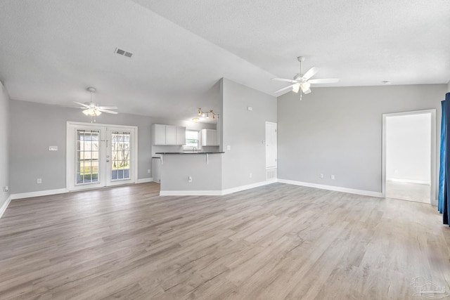 1548 Joseph Cir, Gulf Breeze, FL 32563 - unfurnished living room with visible vents, light wood-style floors, and a ceiling fan