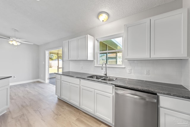 1548 Joseph Cir, Gulf Breeze, FL 32563 - kitchen with a ceiling fan, a sink, tasteful backsplash, stainless steel dishwasher, and light wood finished floors