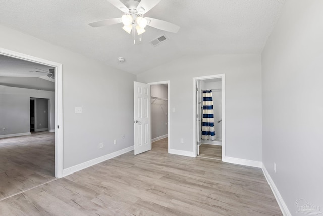 1548 Joseph Cir, Gulf Breeze, FL 32563 - unfurnished bedroom with vaulted ceiling, baseboards, visible vents, and light wood-type flooring