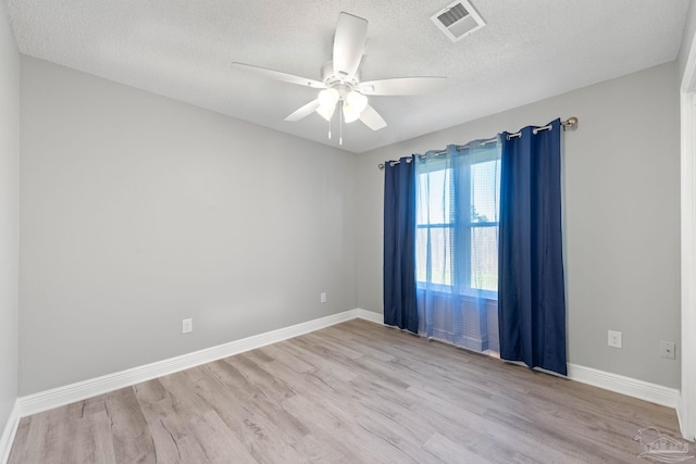 1548 Joseph Cir, Gulf Breeze, FL 32563 - unfurnished room featuring visible vents, baseboards, a ceiling fan, and wood finished floors