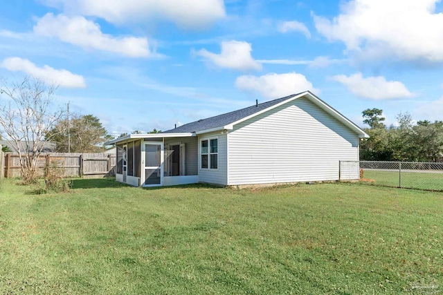 1548 Joseph Cir, Gulf Breeze, FL 32563 - rear view of property featuring a lawn, a fenced backyard, and a sunroom