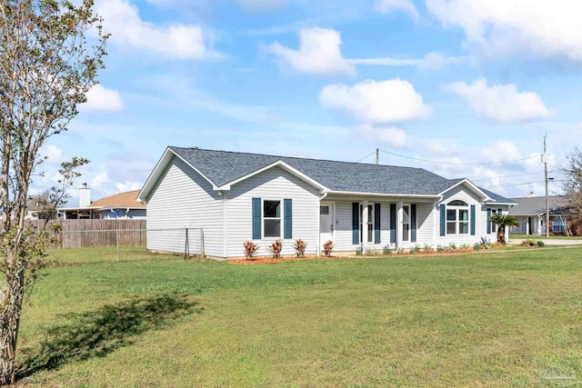 1548 Joseph Cir, Gulf Breeze, FL 32563 - ranch-style home with roof with shingles, a front lawn, and fence