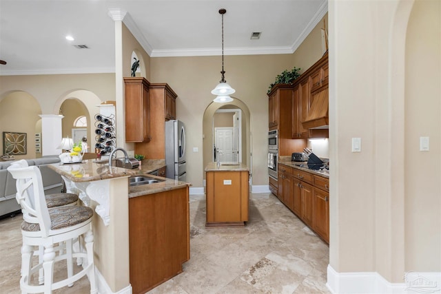 2792 Pga Blvd, Navarre, FL 32566 - kitchen with stainless steel appliances, a sink, arched walkways, crown molding, and light stone counters