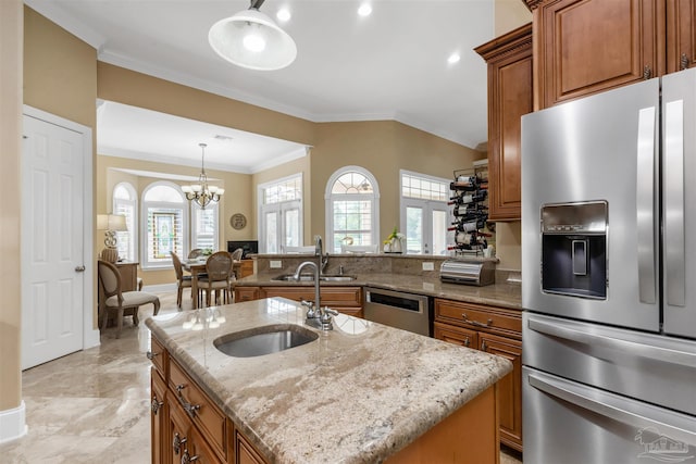 2792 Pga Blvd, Navarre, FL 32566 - kitchen with appliances with stainless steel finishes, a sink, brown cabinetry, light stone countertops, and ornamental molding