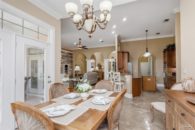 2792 Pga Blvd, Navarre, FL 32566 - dining space featuring arched walkways, light marble finish flooring, ornamental molding, a chandelier, and a ceiling fan