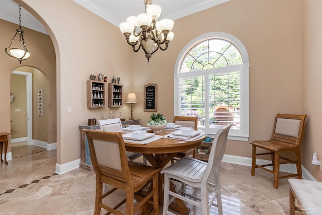 2792 Pga Blvd, Navarre, FL 32566 - dining room with arched walkways, crown molding, a chandelier, and baseboards