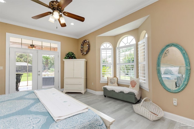 2792 Pga Blvd, Navarre, FL 32566 - bedroom featuring french doors, access to exterior, wood finished floors, crown molding, and baseboards