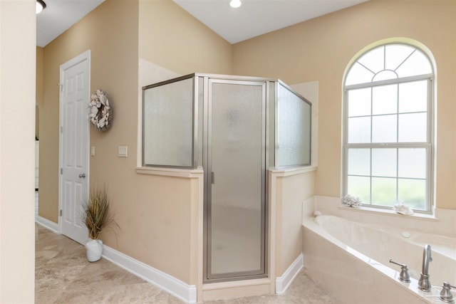 2792 Pga Blvd, Navarre, FL 32566 - full bath featuring a stall shower, a garden tub, and baseboards