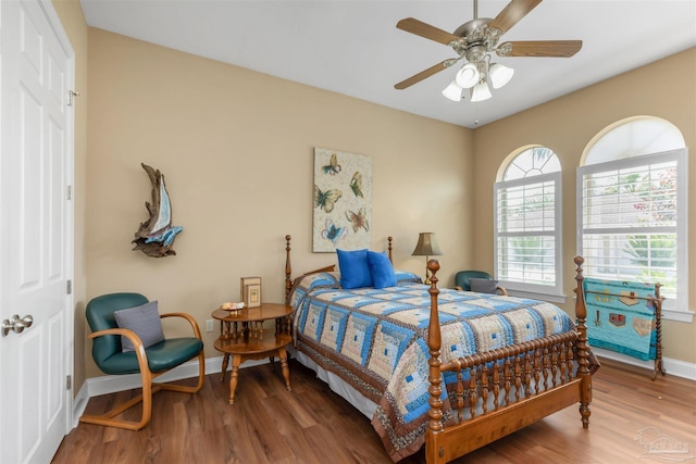 2792 Pga Blvd, Navarre, FL 32566 - bedroom with wood finished floors, baseboards, and ceiling fan
