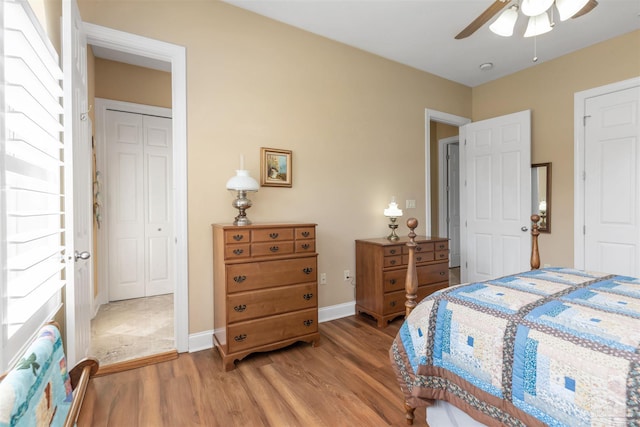 2792 Pga Blvd, Navarre, FL 32566 - bedroom featuring light wood-style flooring, baseboards, a ceiling fan, and a closet