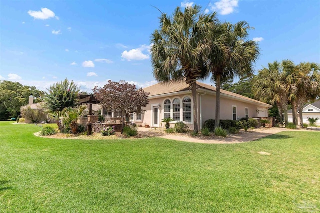 2792 Pga Blvd, Navarre, FL 32566 - view of side of property featuring a yard and stucco siding