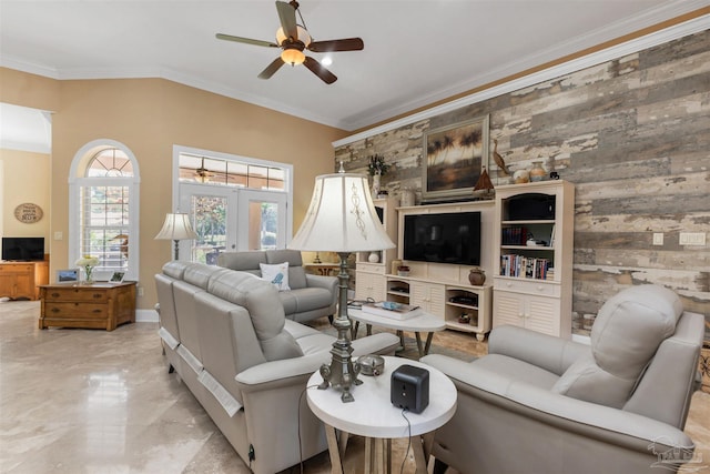 2792 Pga Blvd, Navarre, FL 32566 - living area with a ceiling fan, light marble finish flooring, wood walls, french doors, and crown molding