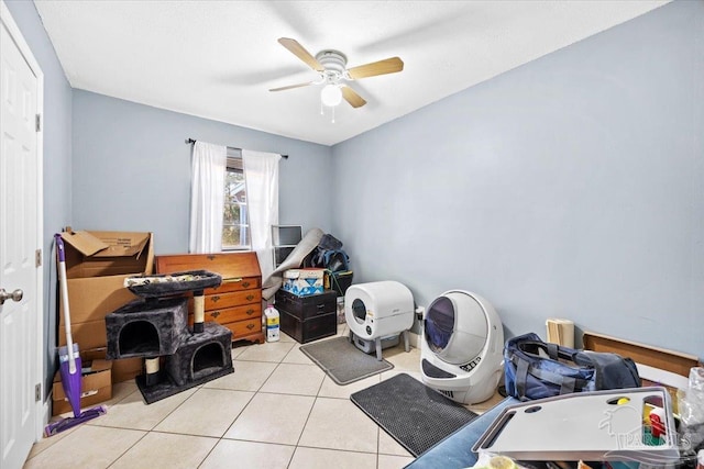 misc room featuring light tile patterned floors and ceiling fan