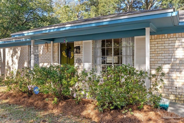 exterior space with brick siding