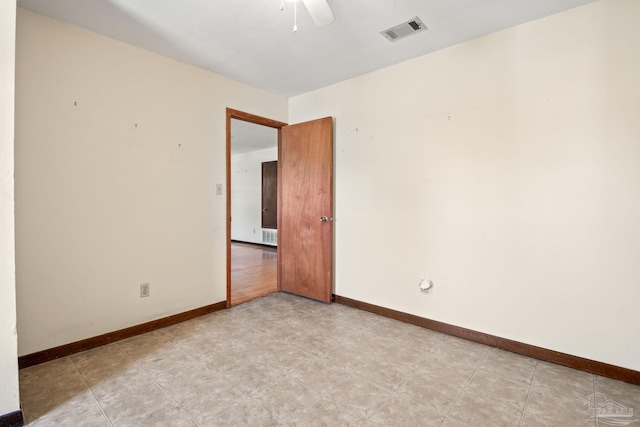 spare room with ceiling fan