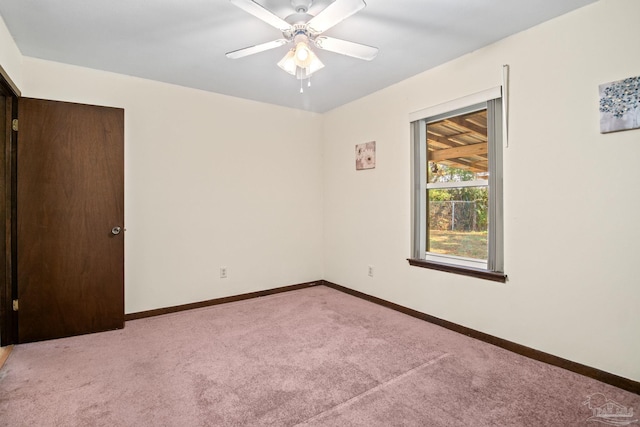 carpeted empty room with ceiling fan