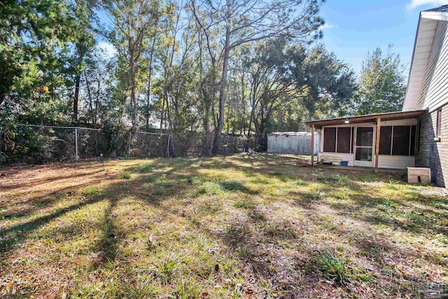 view of yard featuring a sunroom