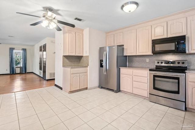 kitchen with decorative backsplash, light tile patterned floors, ceiling fan, and stainless steel appliances