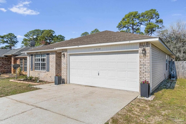 view of front of property featuring a garage, concrete driveway, brick siding, and a shingled roof