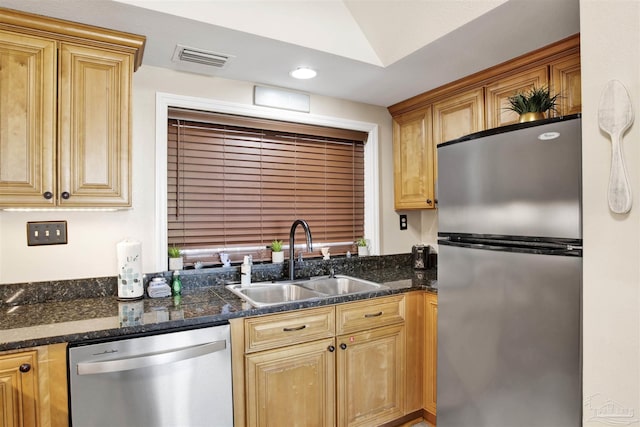 kitchen with sink and appliances with stainless steel finishes