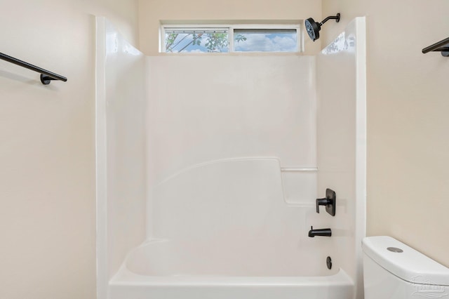 bathroom featuring  shower combination and toilet