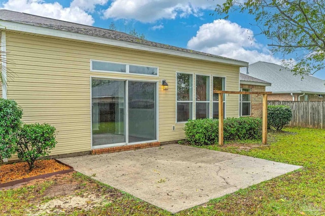 back of property with a patio