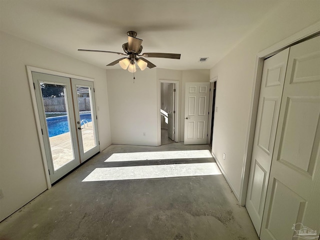 unfurnished bedroom featuring french doors, a closet, access to outside, and ceiling fan