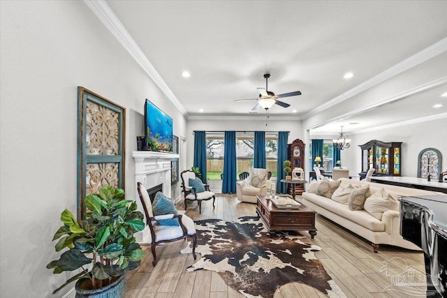 2219 River Birch Rd, Gulf Breeze, FL 32563 - living room with a chandelier, ceiling fan, recessed lighting, wood-type flooring, and a fireplace