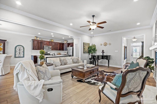 2219 River Birch Rd, Gulf Breeze, FL 32563 - living area featuring a ceiling fan, light wood finished floors, recessed lighting, baseboards, and ornamental molding
