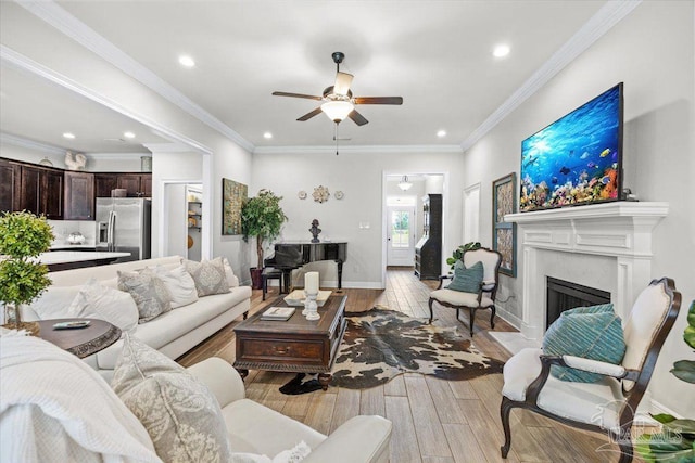 2219 River Birch Rd, Gulf Breeze, FL 32563 - living area featuring light wood-style flooring, a ceiling fan, a fireplace, recessed lighting, and baseboards