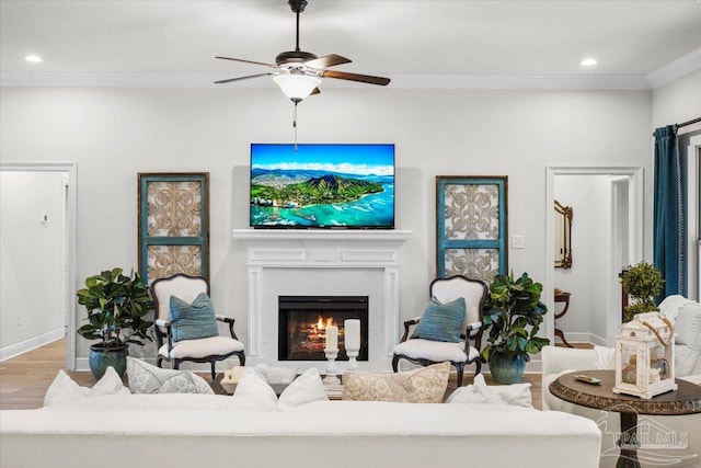 2219 River Birch Rd, Gulf Breeze, FL 32563 - living area featuring wood finished floors, crown molding, a ceiling fan, recessed lighting, and baseboards