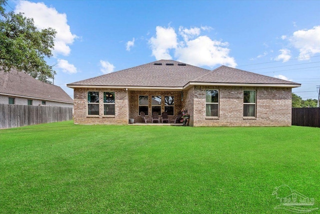 2219 River Birch Rd, Gulf Breeze, FL 32563 - back of property featuring brick siding, a patio area, and a shingled roof