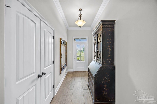 2219 River Birch Rd, Gulf Breeze, FL 32563 - entryway with light wood-style floors, baseboards, and crown molding