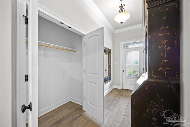 2219 River Birch Rd, Gulf Breeze, FL 32563 - entryway featuring wood finished floors, ornamental molding, and baseboards