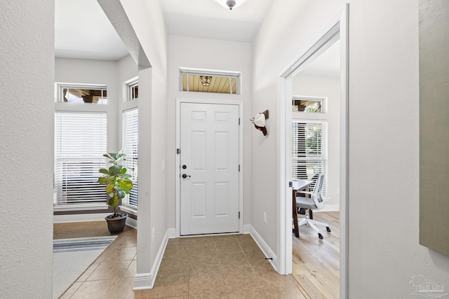 5613 Cane Syrup Cir, Pace, FL 32571 - foyer featuring light tile patterned flooring and baseboards